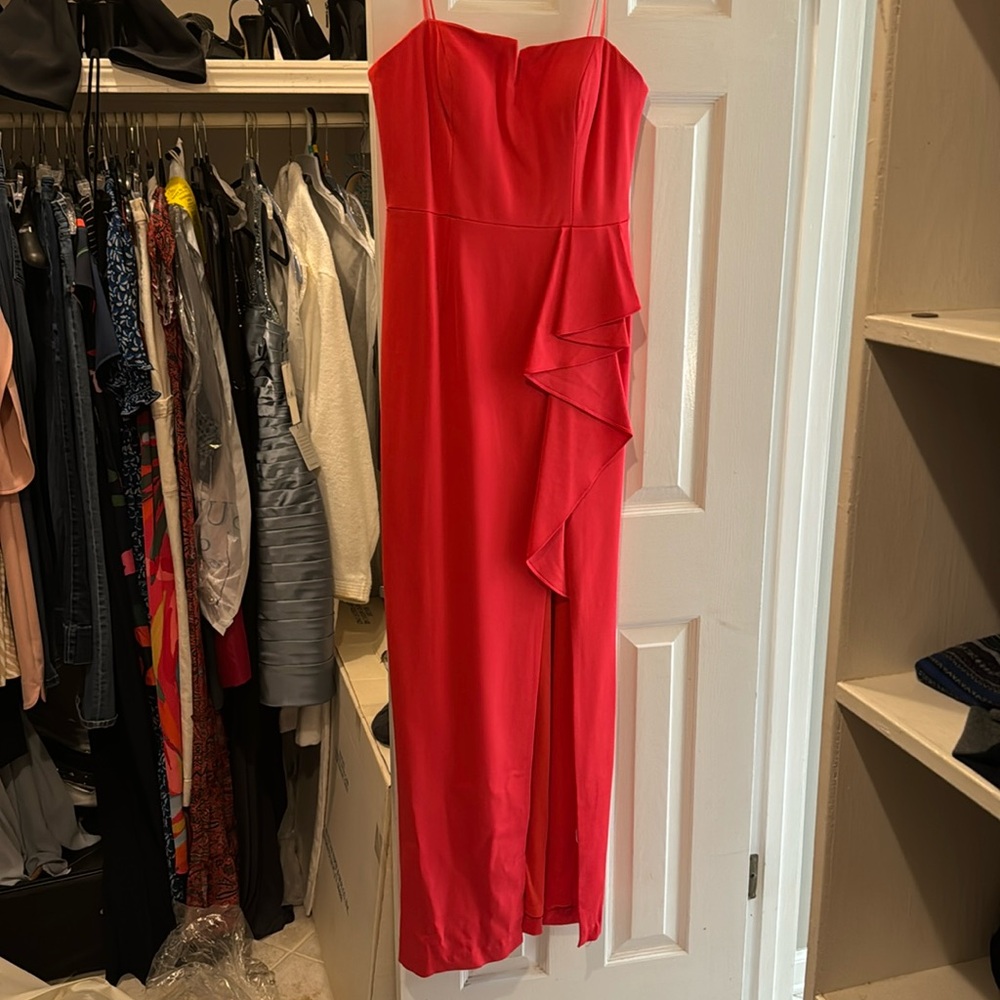 Adrianna Papell red strapless gown with slit.
